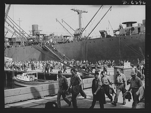 Ship launching in Portland, Maine. Workers leaving docks at a New England shipyard where five British cargo-carrying ships built under lend-lease were christened at a mass launching on August 16, 1942