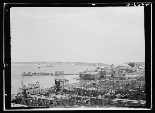 Ship launching in Portland, Maine. New ships rise from the ways as construction is speeded at a New England shipbuilding company. This yard launched eight vessels on August 16, 1942--the greatest tonnage to take the water in one day in the history of Maine shipbuilding