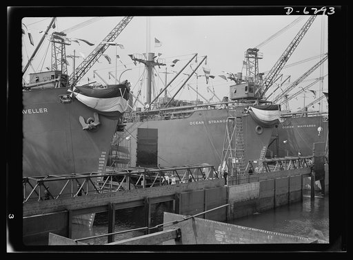 Ship launching in Portland, Maine. Some of the five British cargo-carrying ships built under lend-lease at a large New England yard and launched along with two destroyers and one liberty ship at a record breaking mass launching on August 16, 1942
