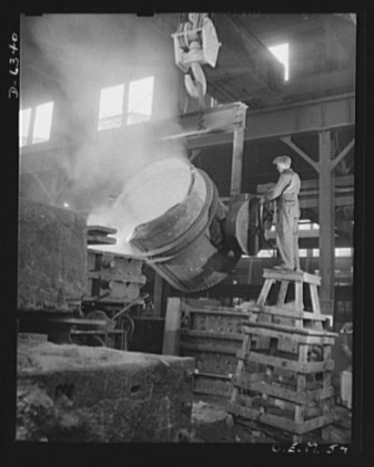 Production. Ship propellers, etc. Molten manganese bronze is poured into a massive mold as a huge ship propeller is cast. A season foundryman in a large war production plant controls the pouring operation. Baldwin Locomotive Works