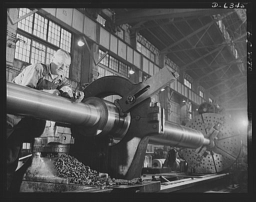 Production. Ship propellers, etc. A huge ship propeller shaft is gauged on the lathe of a large war production plant. Tanks and locomotives are turned out in other parts of the plant. Baldwin Locomotive Works