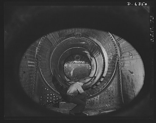 Production. Locomotives. The massive size of this locomotive boiler dwarfs the husky worker inside it. In addition to locomotives, the plant doing this work also turns out tanks and ship propellers. Baldwin Locomotive Works