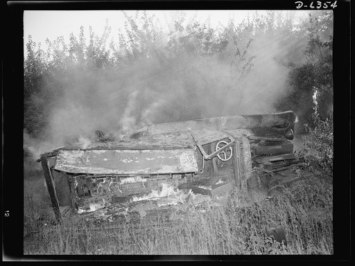 Automobile salvage. Before the torch men, shear men, and press operators go to work on an old automobile, all wooden parts, upholstery, oil, grease and other unusable and inflammable material are removed by burning