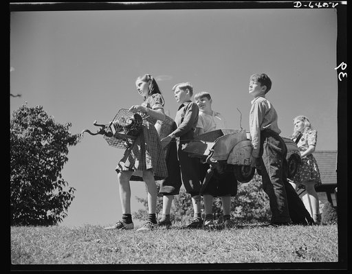 Manpower, junior size. Too young to help? Not the youngsters of Roanoke, Virginia. They're out to win the war by gathering up every piece of scrap metal, every bit of worn-out rubber, and all waste fats and greases in the town