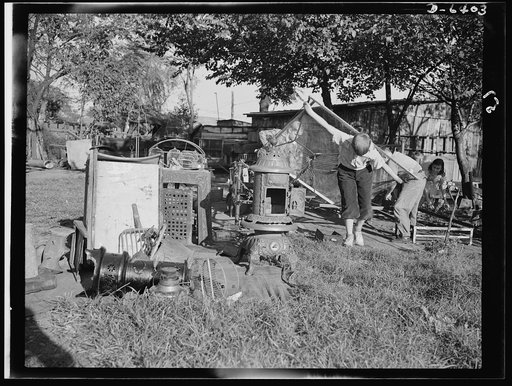 Manpower, junior size. A couple of husky junior commandos add to a neighborhood scrap pile in Roanoke, Virginia. Bedsprings, coal buckets, bird cages, stoves--no piece of unused metal is safe from the hands of these patriotic youngsters who are out to see that their older brothers in the armed force