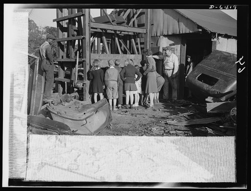 Manpower, junior size. When these hardy fighters of America's junior army do a job, they do it right--with typical American efficiency. Out to see for themselves what happens to the scrap they collect, they pay a visit to a scrapyard in Roanoke, Virginia, and watch a hydraulic press reduce old autom