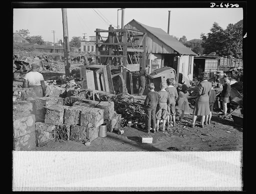 Manpower, junior size. When these hardy fighters of America's junior army do a job, they do it right--with typical American efficiency. Out to see for themselves what happens to the scrap they collect, they pay a visit to a scrapyard in Roanoke, Virginia, and watch the hydraulic press crush jalopies