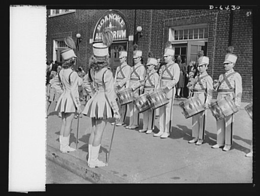 Manpower, junior size. The spirit of '42. The Jefferson High School drum and bugle corps in Roanoke, Virginia started the junior commando rally with a fanfare and a drum roll. Outside of the auditorium, the "military band" prepared to enter the hall where Roanoke school children awaited the opening 