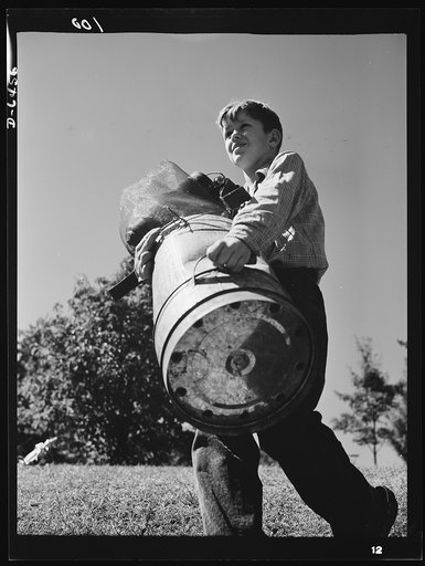 Manpower, junior size. Johnny's got a man-sized job for the duration. His role in this war is a vital one, for every bit of household scrap must be collected to feed America's wartime steel furnaces. Like this Roanoke, Virginia youngster, boys and girls from coast to coast are organizing into squads