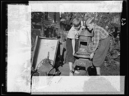 Manpower, junior size. A couple of husky junior commandos add to a neighborhood scrap pile in Roanoke, Virginia. Bedsprings, coal buckets, bird cages, stoves--no piece of unused metal is safe from the hands of these patriotic youngsters, who are out to see that their older brothers in the armed forc