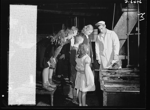 Manpower, junior size. Junior commandos of Roanoke, Virginia, follow up on their fat collection drive with a visit to the local rendering plant to see what happens to the household fats they have collected during the week. They're learning firsthand how explosives are derived from bacon grease and m