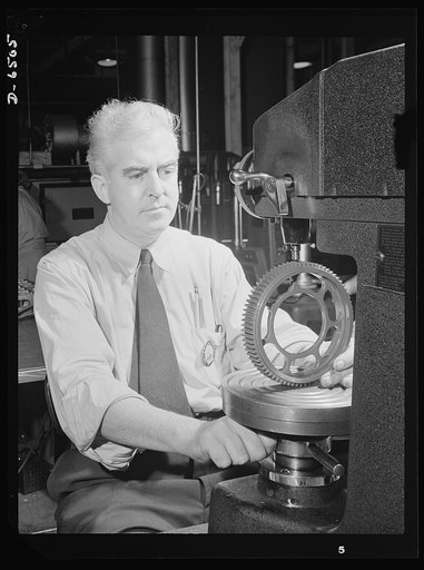 Production. Pratt and Whitney airplane engines. A gear for a Pratt and Whitney engine is tested for hardness on a Rockwell machine in a large Eastern plant now producing a steady flow of airplane motors for the planes that will help us bring victory. Pratt and Whitney Aircraft