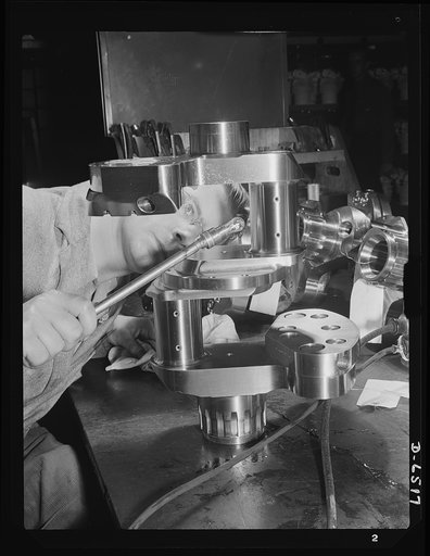 Production. Pratt and Whitney airplane engines. Crankshaft assembles for Pratt and Whitney airplane engines must undergo a rigid inspection in a large Eastern war plant now working full tilt to supply our armed forces with power installations for our war planes. Pratt and Whitney Aircraft