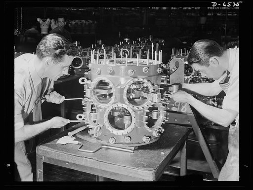Production. Pratt and Whitney airplane engines. Completing the power section assembly of a Pratt and Whitney airplane engine in a large Eastern plant producing at a high rate for the air forces of our Army and Navy. Pratt and Whitney Aircraft