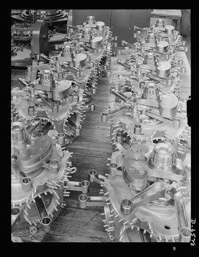 Production. Pratt and Whitney airplane engines. Twin rows of partial power section assemblies for Pratt and Whitney airplane engines form an interesting pattern on the floor of a large Eastern plant now producing great numbers of power installations for our fighting aircraft. Pratt and Whitney Aircr