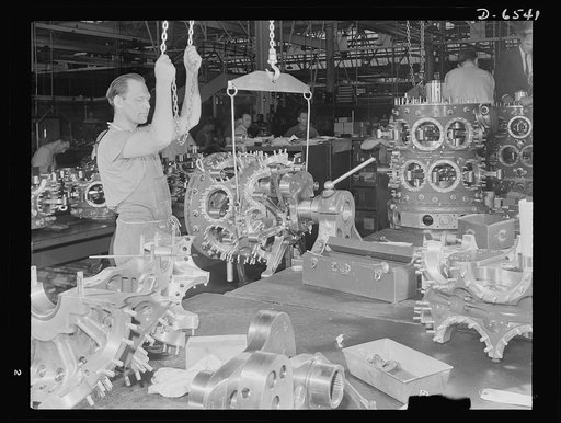 Production. Pratt and Whitney airplane engines. A power section for a Pratt and Whitney airplane engine is installed at a large Eastern plant. This, like all other manufacturing or assembly operations, is handled with the greatest care to assure faultless operation of a fine engine for a fine plane.
