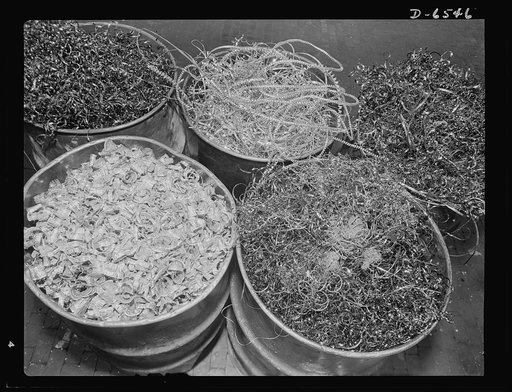 Production. Pratt and Whitney airplane engines. Barrels of salvaged metal scrap collected from a few of the many machines now making parts for Pratt and Whitney airplane engines at a large Eastern plant. When sufficient quantities of these shavings accumulate, they are sent to the steel plants for p
