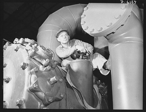 Production. New Tennessee Valley Authority synthetic ammonia plant. Operating a valve servicing on of the gas compressors in the TVA's new synthetic plant in the Muscle Shoals area. Ammonia is made here by the high-pressure synthesis of nitrogen and hydrogen. The ammonia thus secured is converted at