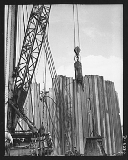 Tennessee Valley Authority power and conservation. Fort Loudoun Dam construction. Steel sheet piling of the cofferdam wall at Fort Loudoun Dam, furthest upstream of the TVA's main Tennessee River projects. Scheduled for closure and first storage of water early in 1943, this dam will create a 15,000-