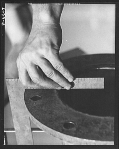 Tennessee Valley Authority power and conservation. Fort Loudoun Dam construction. A pipe fitter measures up and squares up as a new pipeline is fitted at the Fort Loudoun Dam, furthest upstream of the TVA's Tennessee River projects. Scheduled for closure and first storage of water early in 1943, thi