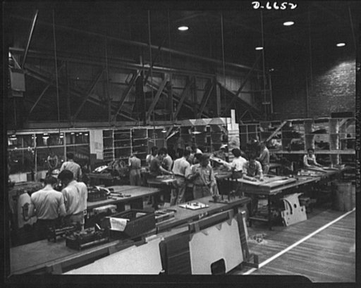 Production. Lockheed P-38 pursuit planes. Small section for Lockheed P-38 pursuit planes are prepared for subassembly in a large Western aircraft plant. The completed subassemblies travel along lines that eventually meet the main assembly line from which finished planes are rolled outdoors for the i