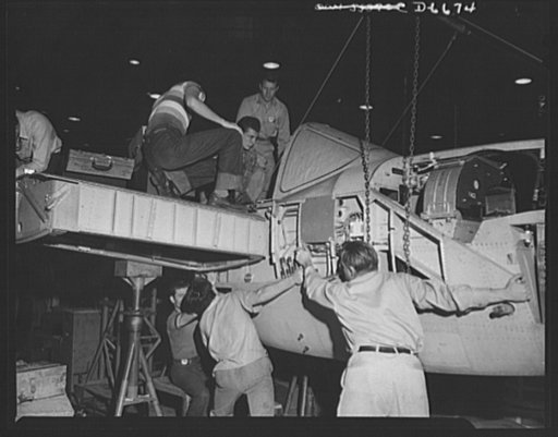 Production. Lockheed P-38 pursuit planes. The nose section of a Lockheed P-38 pursuit plane is "mated" with a center section in a large Western aircraft plant. The partly-finished ship will then travel down the main assembly line for the installation of engines, wings, landing gear and other essenti