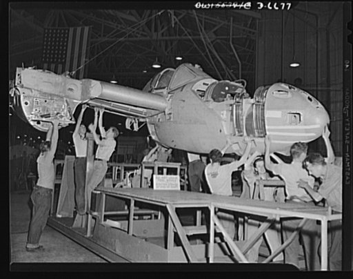 Production. Lockheed P-38 pursuit planes. A partly-finished Lockheed P-38 pursuit ship is lowered away into a rolling cradle in a large Western aircraft plant. Supported in this cradle, the ship has now taken its place in the main assembly line. The cradle or stand is moved from station to station w