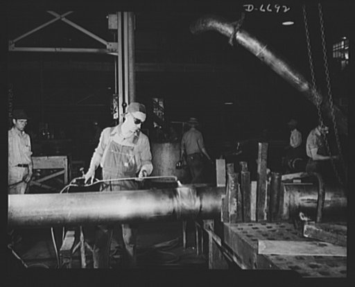 Manpower. Southern shipyard workers. A grocery store manager for thirteen years, C.R. Summers now is a sheet metal worker in a Southern Navy yard. Following a short training course in this work, he became adept at the job shown here, brazing on the sleeves that join lengths of copper tubing for Navy