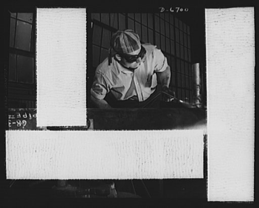 Manpower. Southern shipyard workers. Leaning over his torch, this skilled worker brazes a joint in a section of copper tubing. Without previous experience in this field, this worker was trained in a short time for this operation in a Southern Navy yard