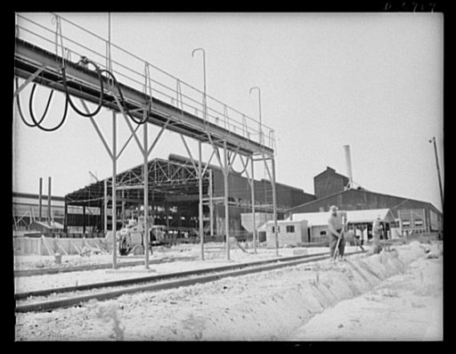 Production. Tin smelting. A new furnace building under construction at a Southern tin smelter. Pure tin will be produced here from South American ore to meet the countless war needs of the United Nations. This smelting operation, the first of its magnitude in the United States, has already achieved 