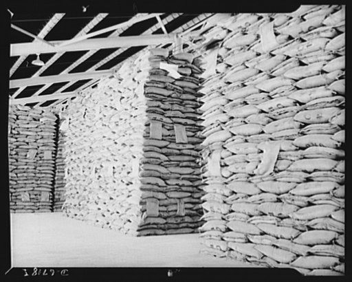 Production. Tin smelting. Raw tin from South American mines is stored at a Southern smelter where the pure metal will be extracted to meet the countless war needs of the United Nations. Each stack of bags represents a fifteen thousand dollar value