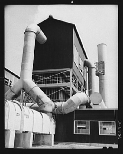 Production. Tin smelting. Tin is recovered from smelting furnace smoke in a Southern operation that produces pure tin from South American ore. All the smoke from the furnace is carried by long tubes to Cottrell precipitating units as shown. Here an electrical current of 65,000 volts throws out all t