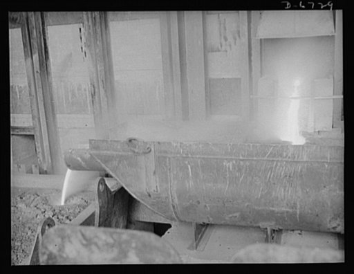 Production. Tin smelting. Tapping the furnace of a Southern tin smelter in which pure tin is extracted from the raw ore of South American mines. Here tin is drawn off into floats which weigh about eighteen tons when filled. The metal is then conveyed to polling kettles, where dross or skimmings are 