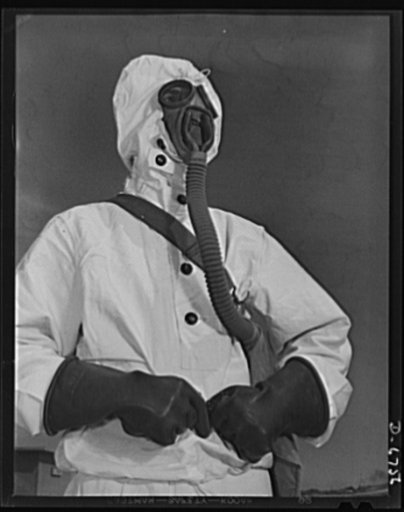 Naval air base. Corpus Christi, Texas. Like a man from Mars, a sailor at the Corpus Christi, Texas, naval air base wears the new type of protective clothing and gas mask designed for use in chemical warfare. These uniforms are lighter than the old type