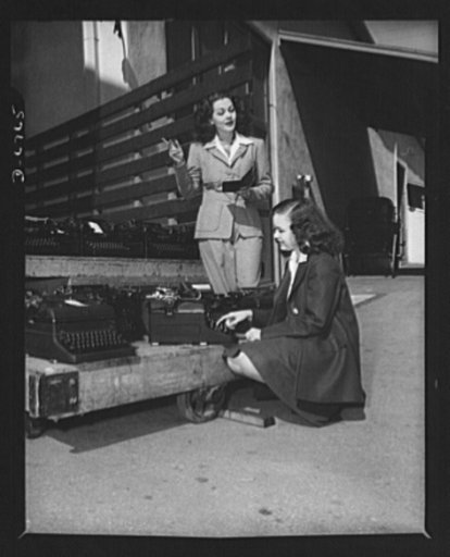 Send your typewriters to war. At Universal City, California, Maria Montez, glamorous Latin-American movie star, and Gloria Jean, typical of young America in Hollywood, helped collect over one hundred typewriters for the Army, Navy, and Marines. Only machines manufactured since January 1, 1935 were c
