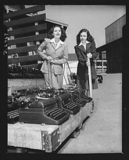 Send your typewriters to war. At Universal City, California, Maria Montez, glamorous Latin-American movie star, and Gloria Jean, typical of young America in Hollywood, helped collect over one hundred typewriters for the Army, Navy, and Marines. Only machines manufactured since January 1, 1935 were c