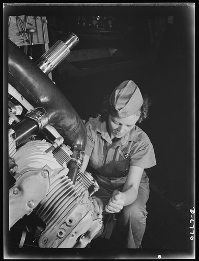 Naval air base, Corpus Christi, Texas. A top-notch mechanic, Mary Josephine Farley expertly rebuilds airplane engines. Although she's only twenty-years-old, she has a private pilot's license and has made several cross country flights. She ranked highest of all competitors on her civil service examin