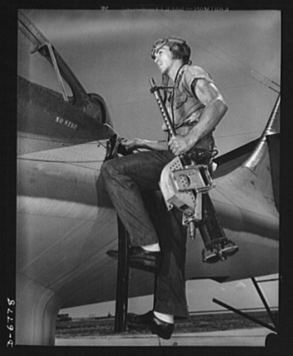 Naval air base, Corpus Christi, Texas. It's an intricate operation, installing a thirty-caliber machine gun in a Navy PBY plane, but not too trickey for Jesse Rhodes Waller. He's a Georgia man who's been in the Navy five and a half years. At the naval air base in Corpus Christi, Texas, he sees that 