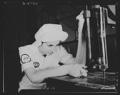 Naval air base. Corpus Christi, Texas. "Women in white" doctor Navy airplane motors at the Corpus Christi, Texas, naval air base. Mildred Webb, a National Youth Administration (NYA) trainee at the base is learning to operate a cutting machine in the Assembly and Repair Department. After about eight 
