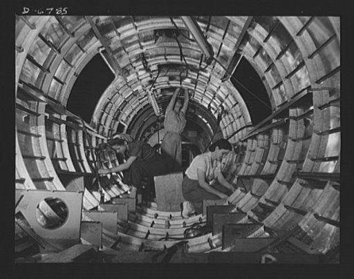Production. B-17F heavy bombers. Women workers install fixtures and assemblies to a tail fuselage section of a B-17F Bomber at the Long Beach, California plant of Douglas Aircraft Company. Better known as the "Flying Fortress," the B-17F is a later model of the B-17 which distinguished itself in act