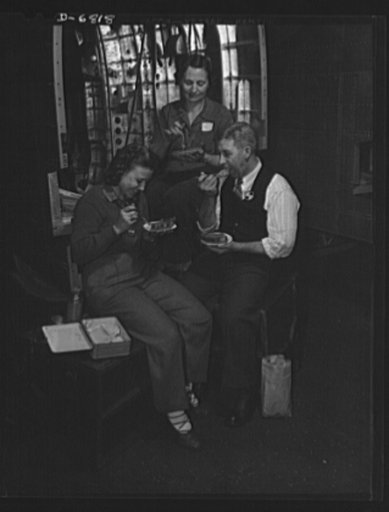 Thanksgiving, 1942. American workers give up the holiday to speed victory. The Blackwelder family celebrated Thanksgiving at their benches in a Glenn Martin Company plant. William P. Blackwelder works in the tool crib of the plane factory, and his wife and daughter are riveters. A son, Frank, in the