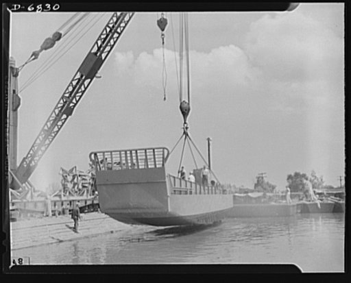 Production. Fifty-foot steel ramp boats. Launching a fifty-foot steel ramp boat, just completed at a Southern boatyard. Boats of this kind, powered by twin diesel engines, are used in making beach landings of men, tanks and other equipment on hostile shores. After a trial run this boat will be remov