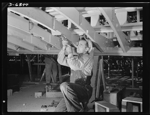 Production. Motor torpedo boats (wooden). Hand trades are important in the building of wooden boats for the Navy. This man working with a chisel on a beam of a motor torpedo boat in a Southern shipyard performs an essential war task. Higgins Industries