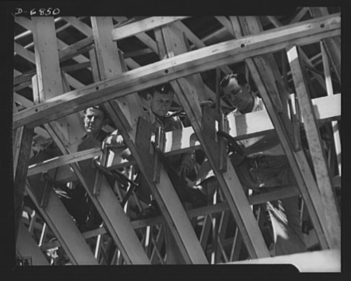 Production. Motor torpedo boats (wooden). Prefabricated sections of a new seventy-eight-foot motor torpedo boat are clamped in place at a large Southern shipyard. The hulls of these speedy boats are built indoors and are then moved to nearby water for launching and fitting. Higgins Industries