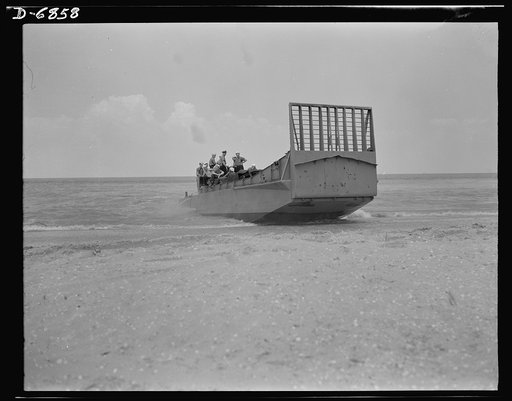 Training. Ramp boats. A fifty-foot steel ramp boat capable of landing tanks and large forces of men at beach positions. The large gate-like section facing the beach is hinged to drop forward on the sand and form a ramp for the passage of men and equipment. The Southern shipyard that makes these boat