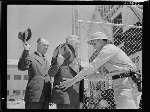 Production. Fifty-foot steel ramp boats. Every visitor is "frisked" for weapons or other forbidden articles as he enters the plant of a Southern boat building company producing ramp boats, torpedo boats and other Navy craft. Production of fifty-foot steel ramp boats was underway at this plant before