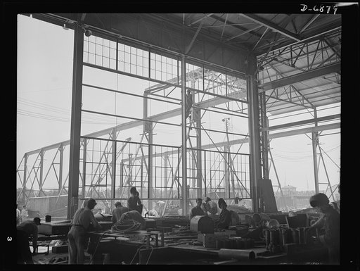 Production. Fifty-foot steel ramp boats. Building construction goes on at a Southern boat building yard now producing large numbers of ramp boats, torpedo boats and other Navy craft. Long before the buildings were finished many of the boats had been turned out on open-air assembly lines. Higgins Ind