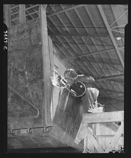 Production. Fifty-foot steel ramp boats. An electric arc welder "runs a bead" on a joint in a fifty-foot steel ramp boat on the production line of a Southern boat building equipment on hostile shores. The plant is also turning out torpedo boats, smaller wooden ramp boats and other Navy craft. Higgin