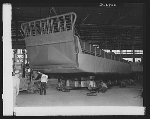 Production. Fifty-foot steel ramp boats. A new fifty-foot steel ramp boat, ready for launching, is rolled off the production line of a Southern boatyard. This boat will be used in making beach landings of men, tanks and other equipment on hostile shores. The yard is also making torpedo boats, smalle