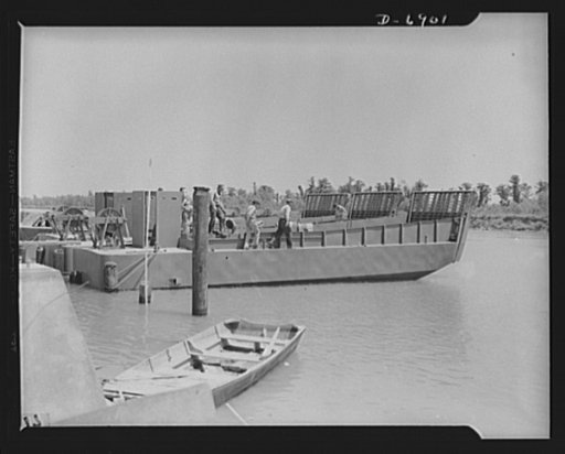 Production. Fifty-foot steel ramp boats. Three fifty-foot steel ramp boats, just completed at a Southern boatyard, await trial runs. Boats of this kind are used in making beach landings of men, tanks and other equipment on hostile shores. The yard is also making torpedo boats, smaller wooden ramp bo